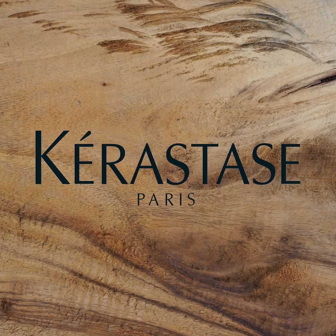 Logo of Kérastase Paris on a textured wooden background.